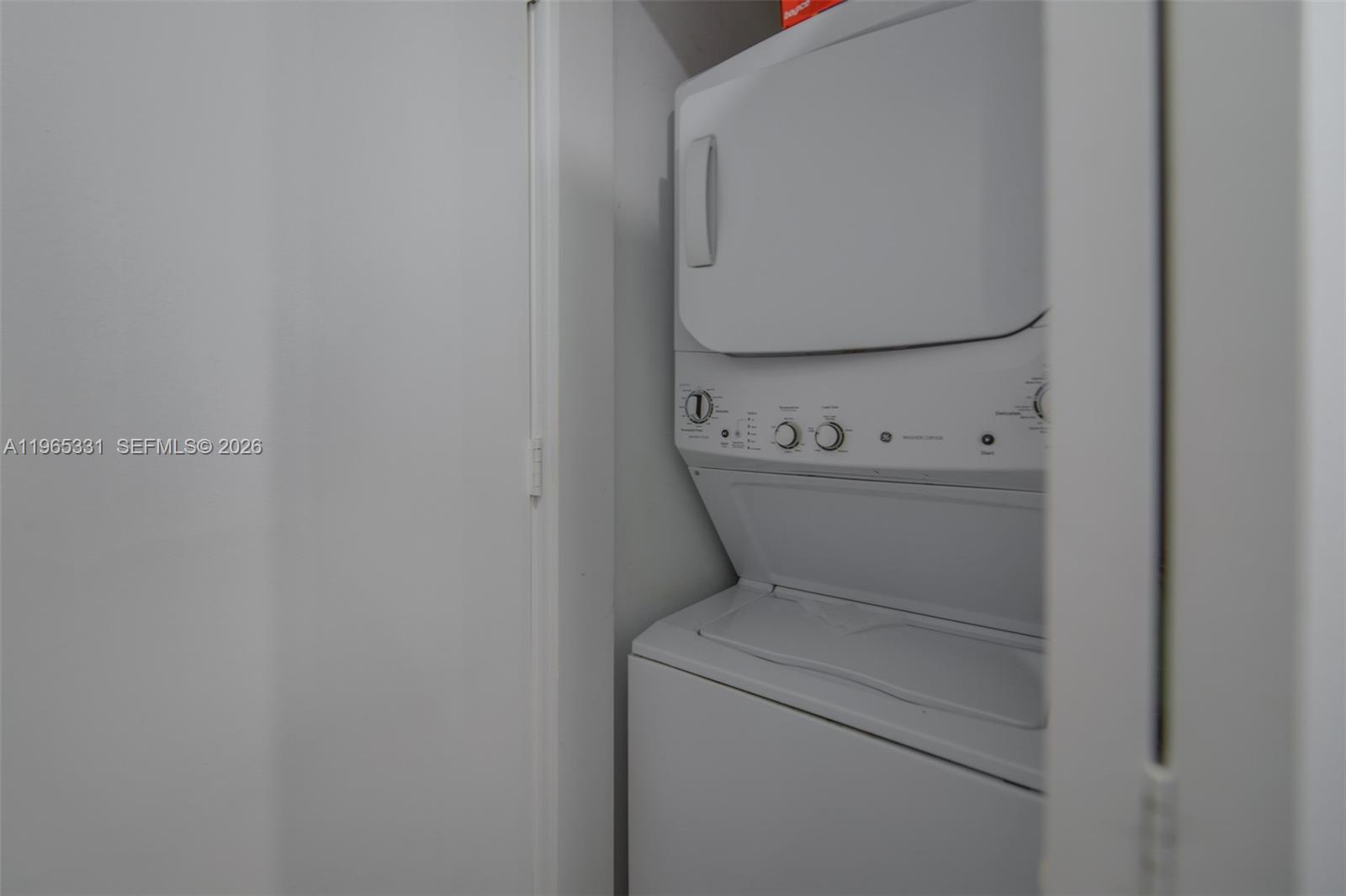 45 Southwest 9th Street, Unit 1107 Miami, FL 33130 - Photo 18 of 50 a utility room with dryer and washer