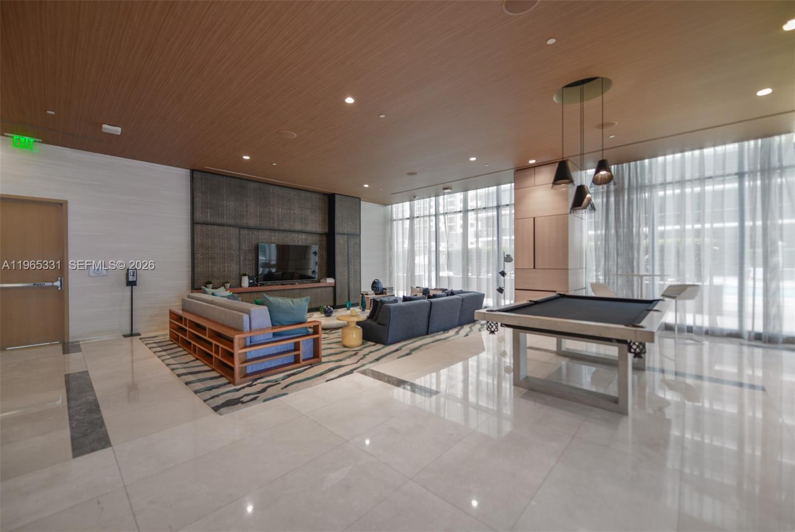 45 Southwest 9th Street, Unit 1107 Miami, FL 33130 - Photo 25 of 50 a living room with furniture and a flat screen tv