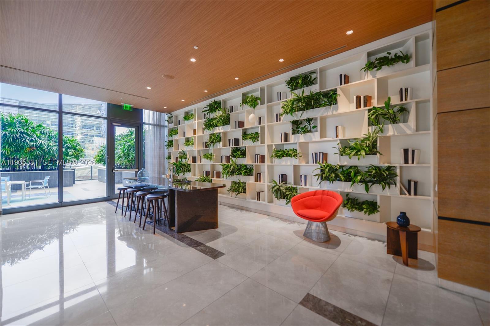 45 Southwest 9th Street, Unit 1107 Miami, FL 33130 - Photo 27 of 50 a living room with a couch and potted plants