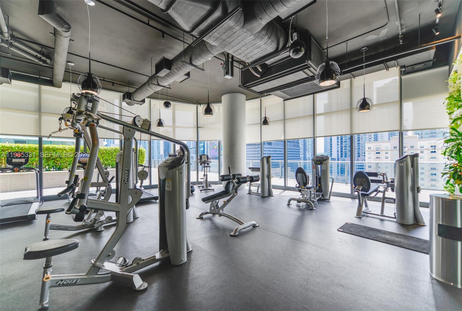 45 Southwest 9th Street, Unit 1107 Miami, FL 33130 - Photo 35 of 50 a view of a room with gym equipment