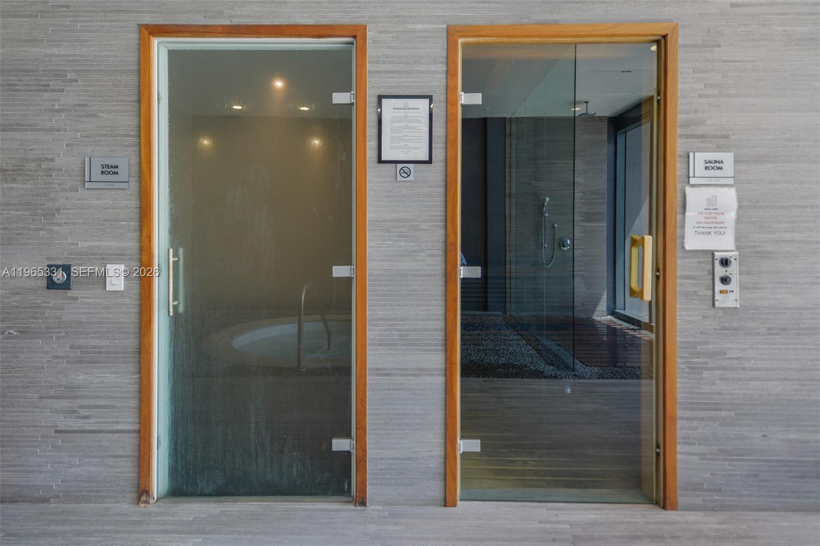 45 Southwest 9th Street, Unit 1107 Miami, FL 33130 - Photo 39 of 50 a bathroom with a glass door shower and vanity