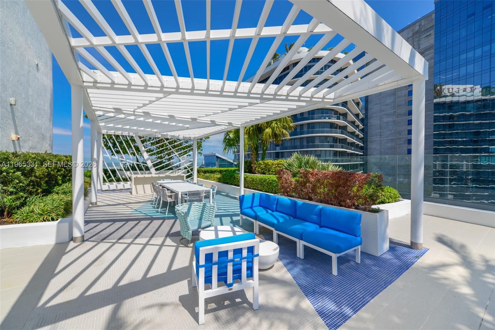 45 Southwest 9th Street, Unit 1107 Miami, FL 33130 - Photo 48 of 50 a view of a chairs and table in the patio