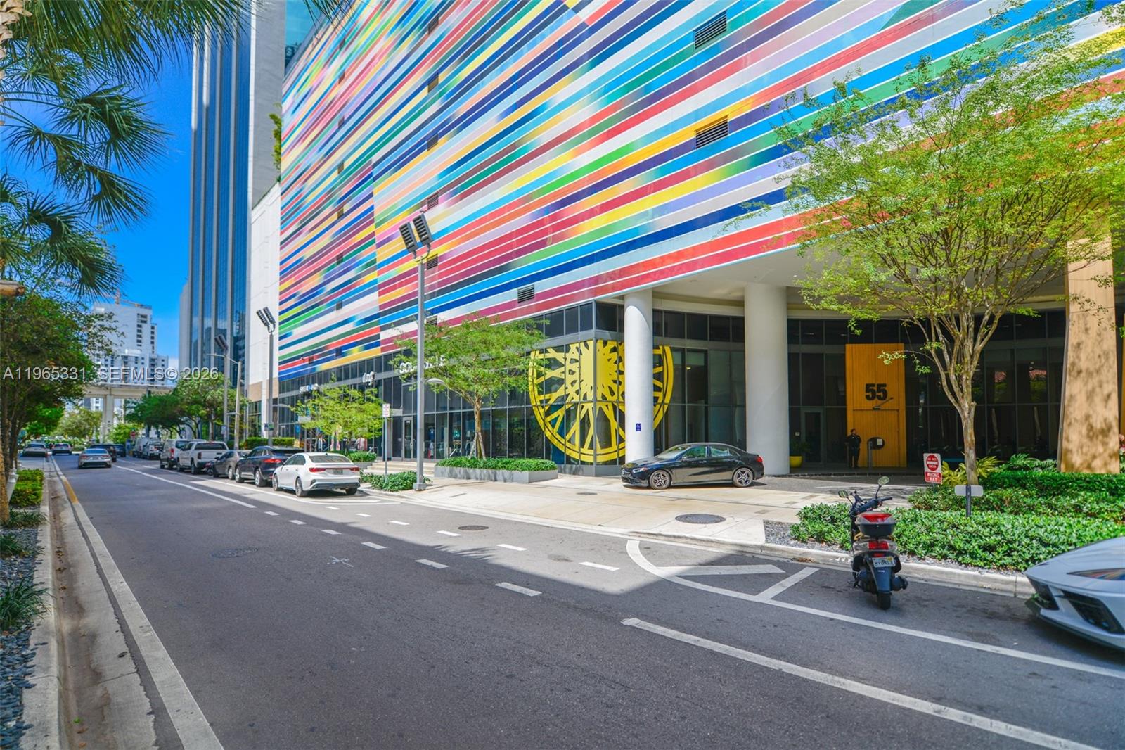 45 Southwest 9th Street, Unit 1107 Miami, FL 33130 - Photo 50 of 50 a view of street with tall buildings and a bench