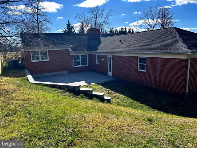a view of house with yard