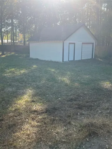 a view of a big room with closet and windows