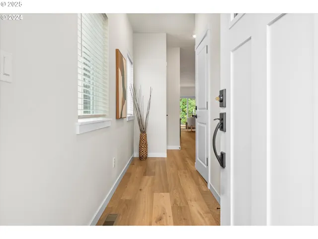 a hallway with a white wooden door