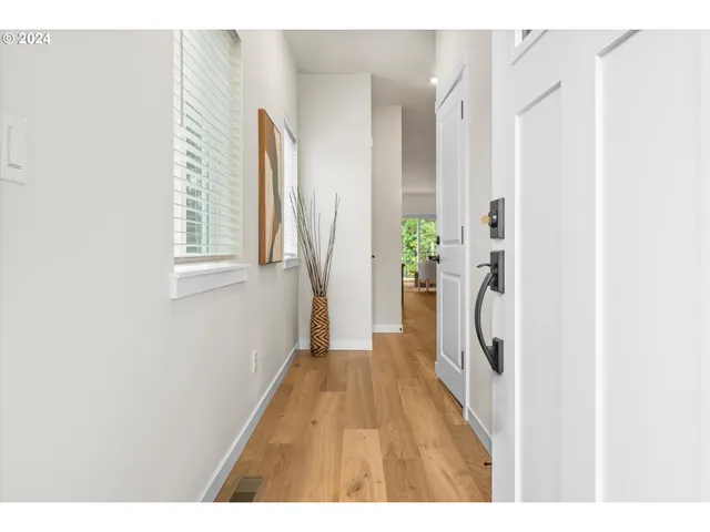 a hallway with a white wooden door