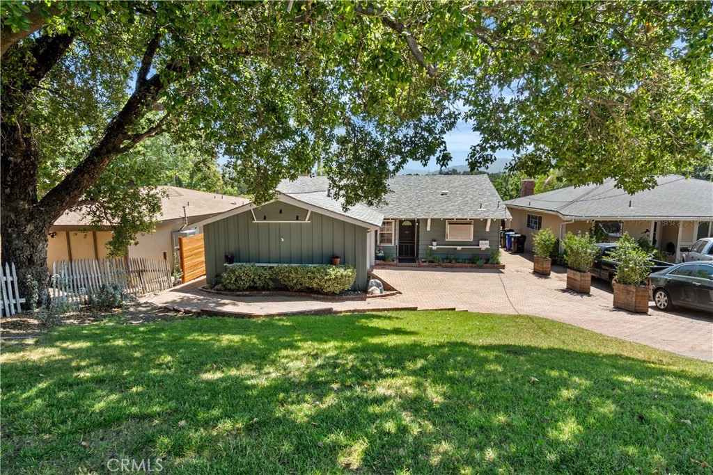 25140 Wheeler Road Newhall, CA 91321 - Photo 1 of 1 a front view of a house with a yard and trees