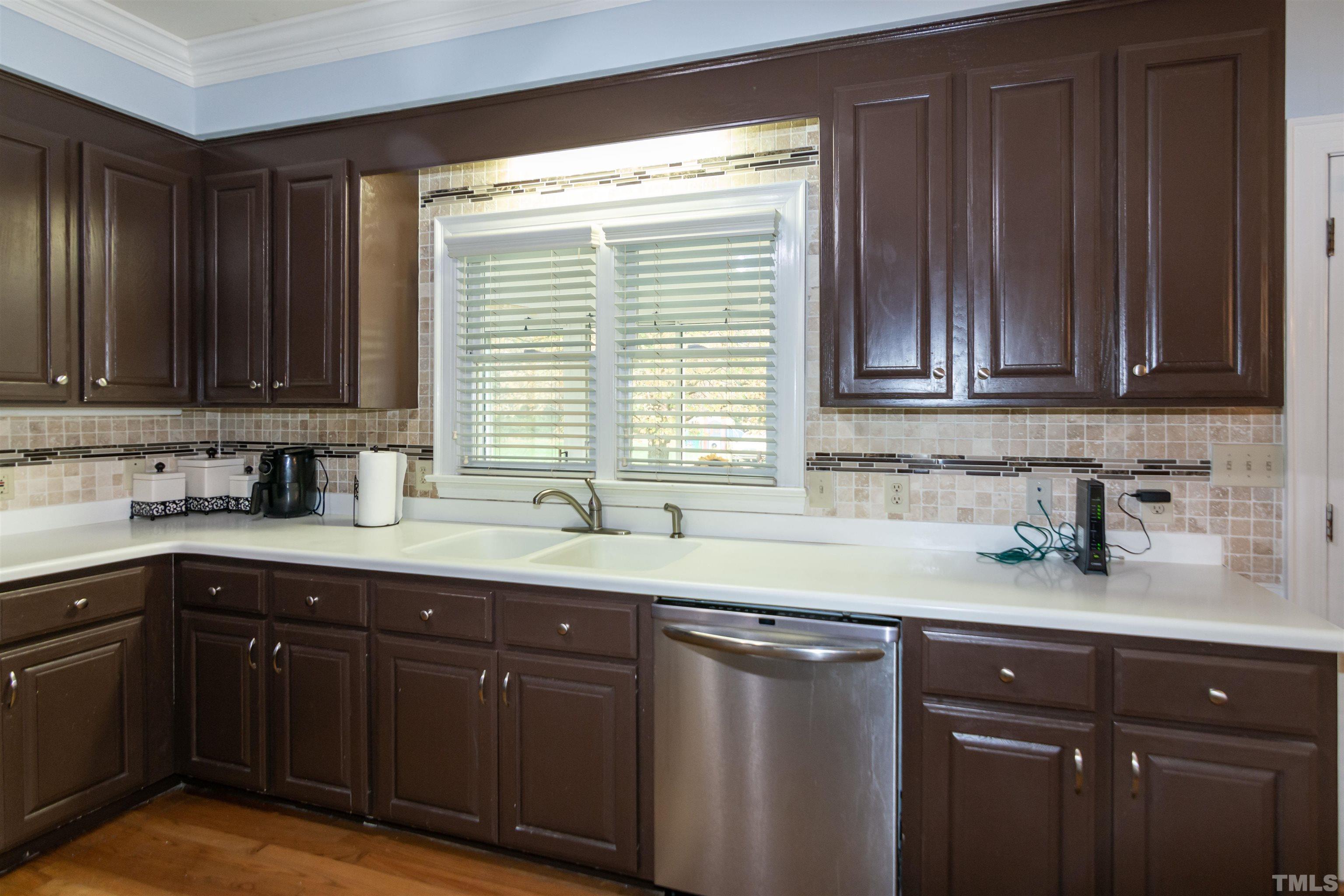 7020 Zebulon Road Wake Forest, NC 27587 - Photo 13 of 45 a kitchen with stainless steel appliances granite countertop a sink dishwasher stove and cabinets