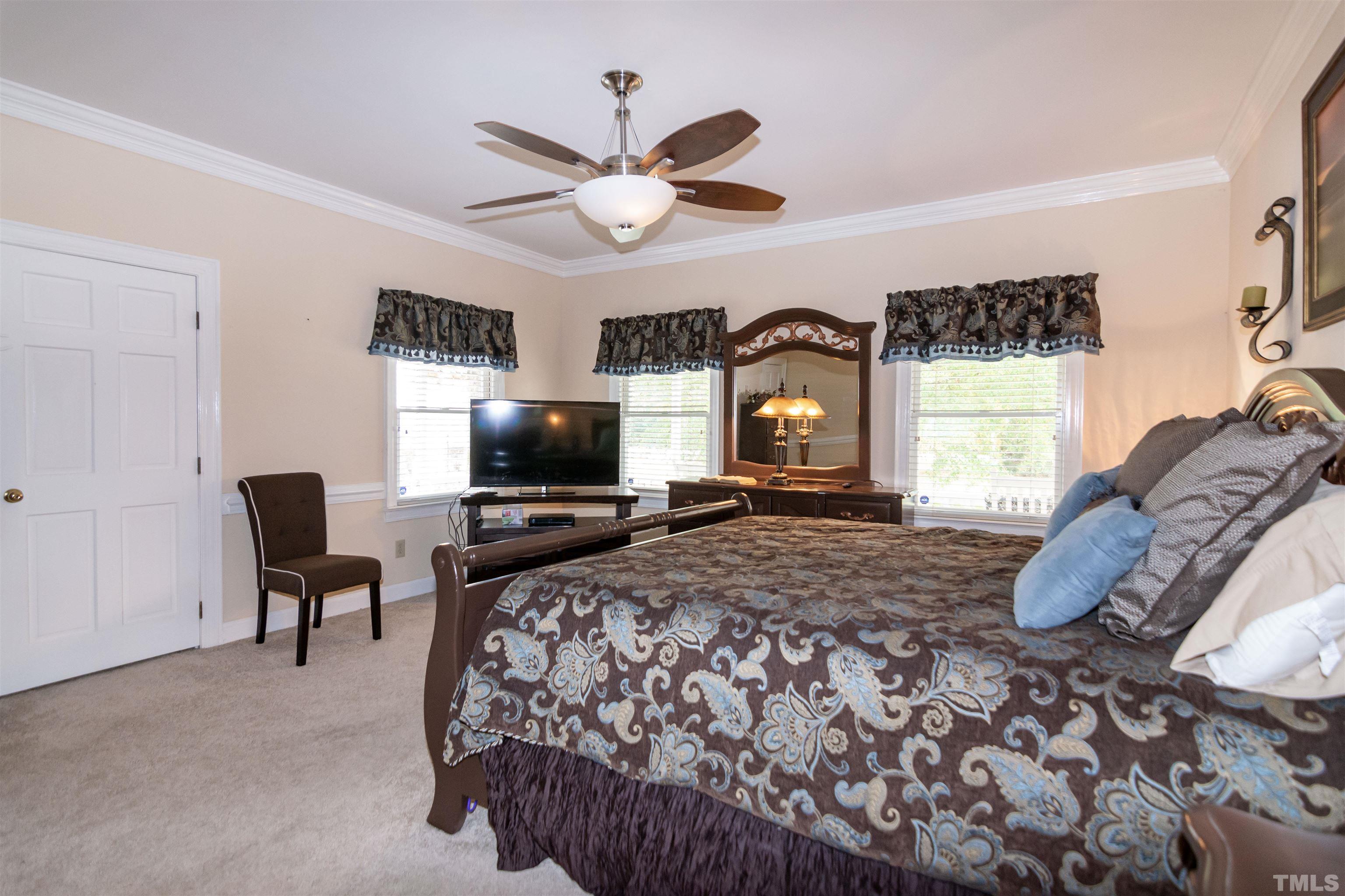 7020 Zebulon Road Wake Forest, NC 27587 - Photo 15 of 45 a bedroom with a bed and a television