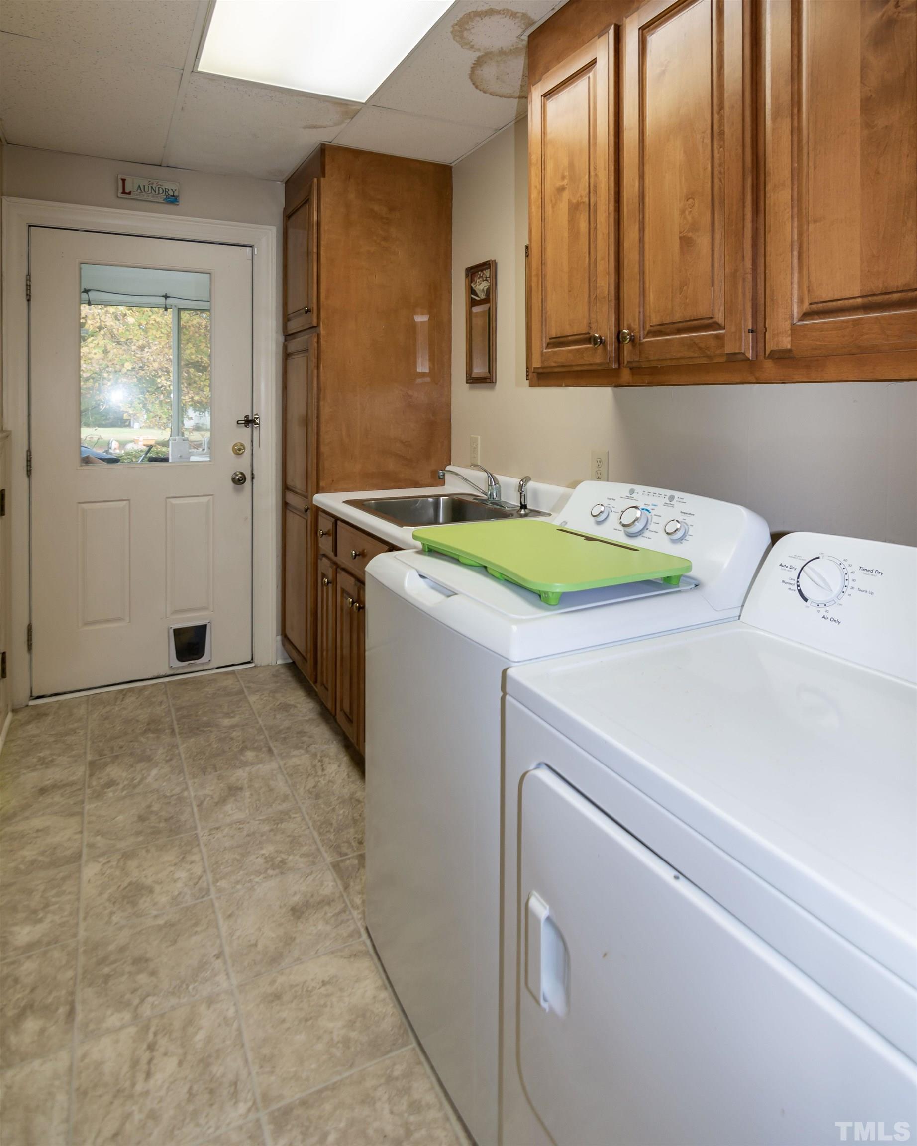 7020 Zebulon Road Wake Forest, NC 27587 - Photo 19 of 45 a utility room with dryer and washer