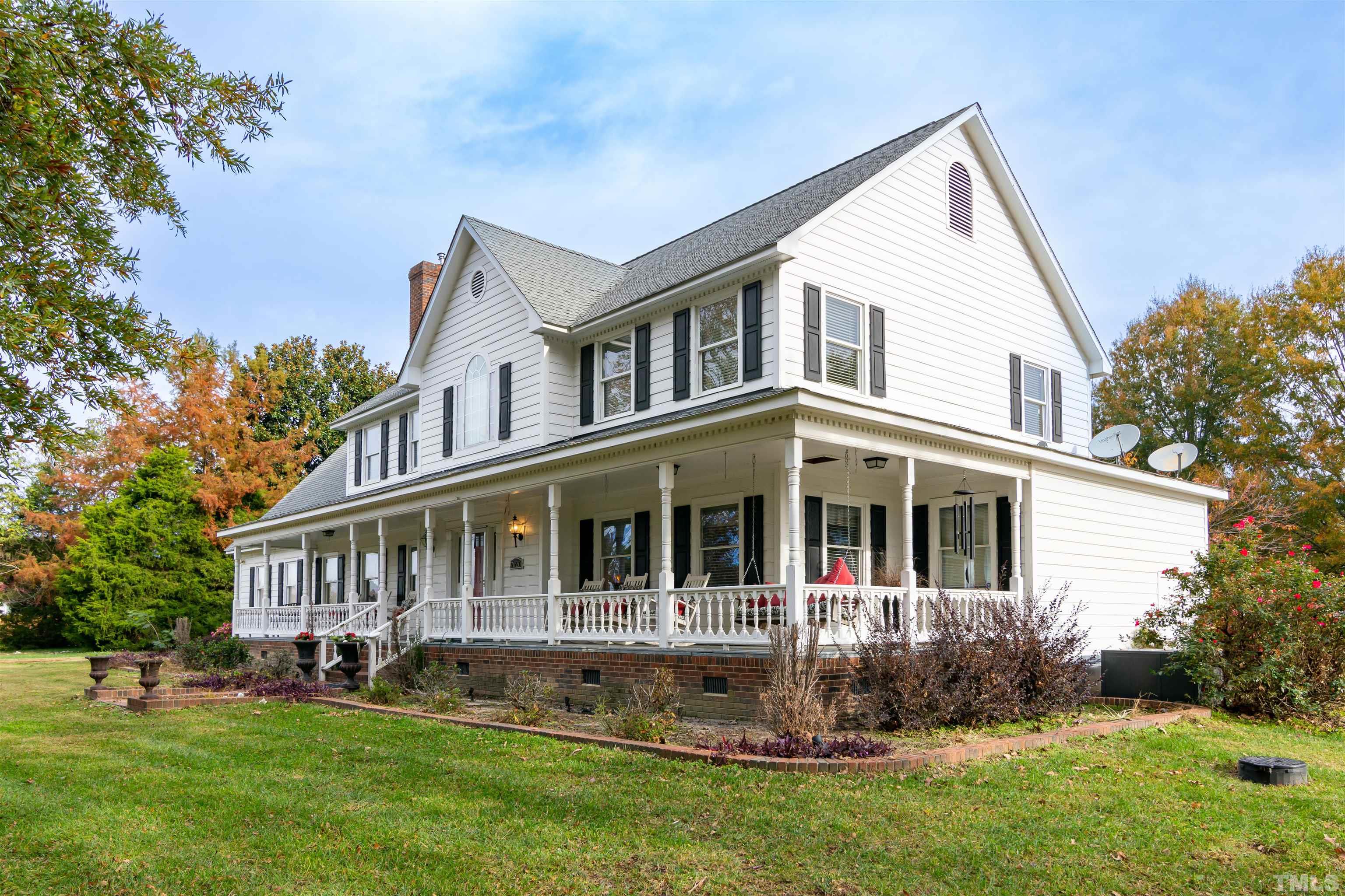 7020 Zebulon Road Wake Forest, NC 27587 - Photo 2 of 45 a front view of a house with a yard