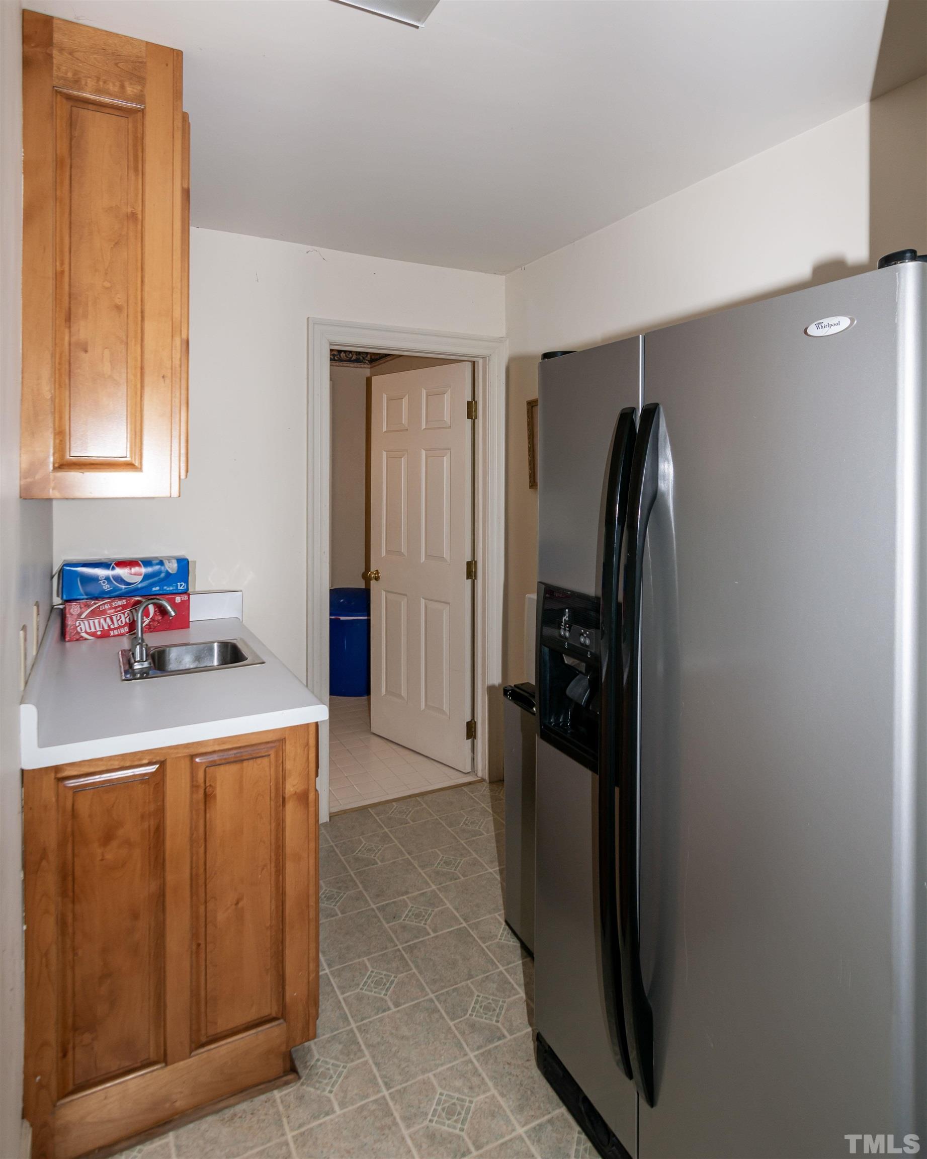 7020 Zebulon Road Wake Forest, NC 27587 - Photo 28 of 45 a kitchen with stainless steel appliances granite countertop a refrigerator and a stove