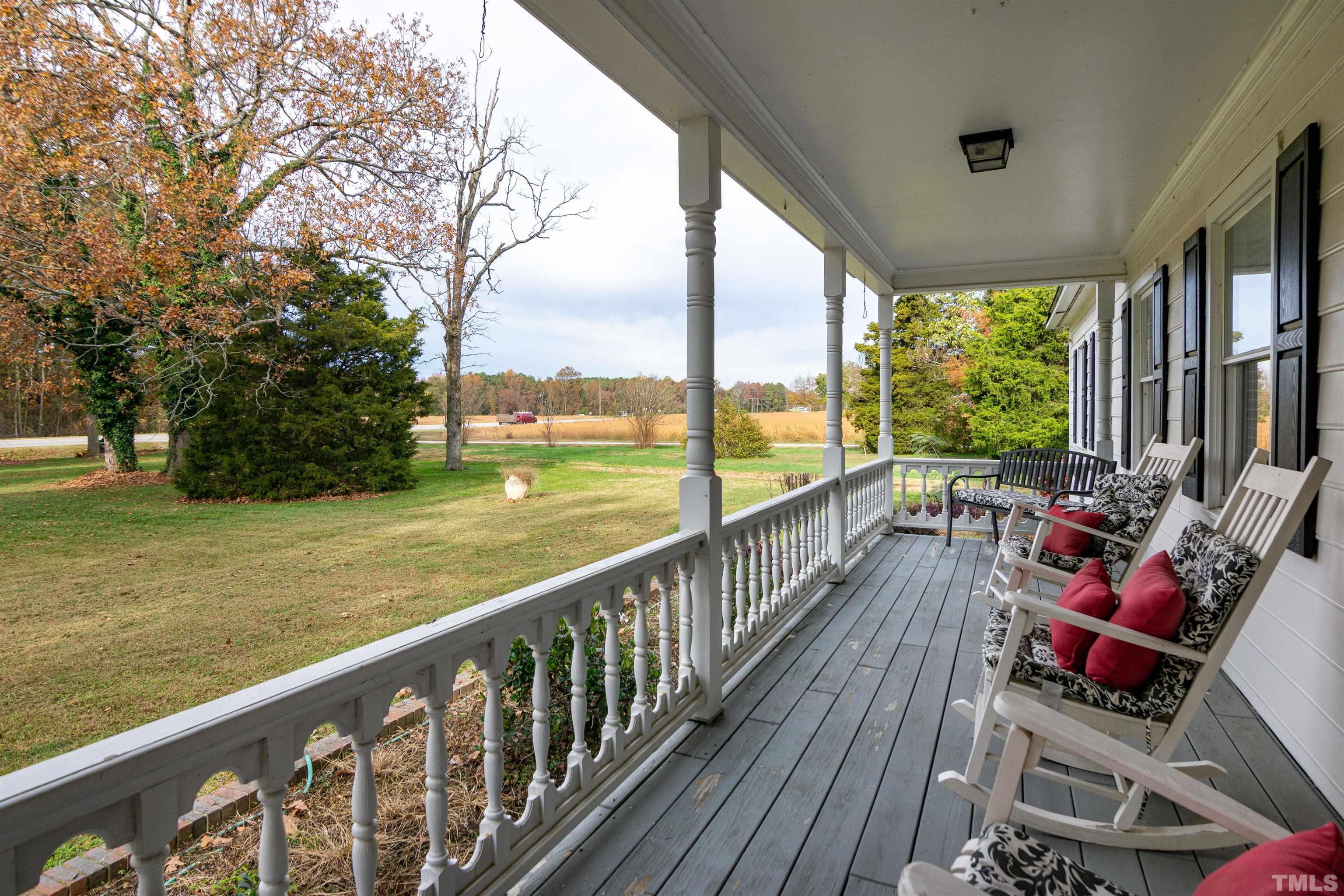 7020 Zebulon Road Wake Forest, NC 27587 - Photo 3 of 45 a view of balcony with wooden floor and outdoor space