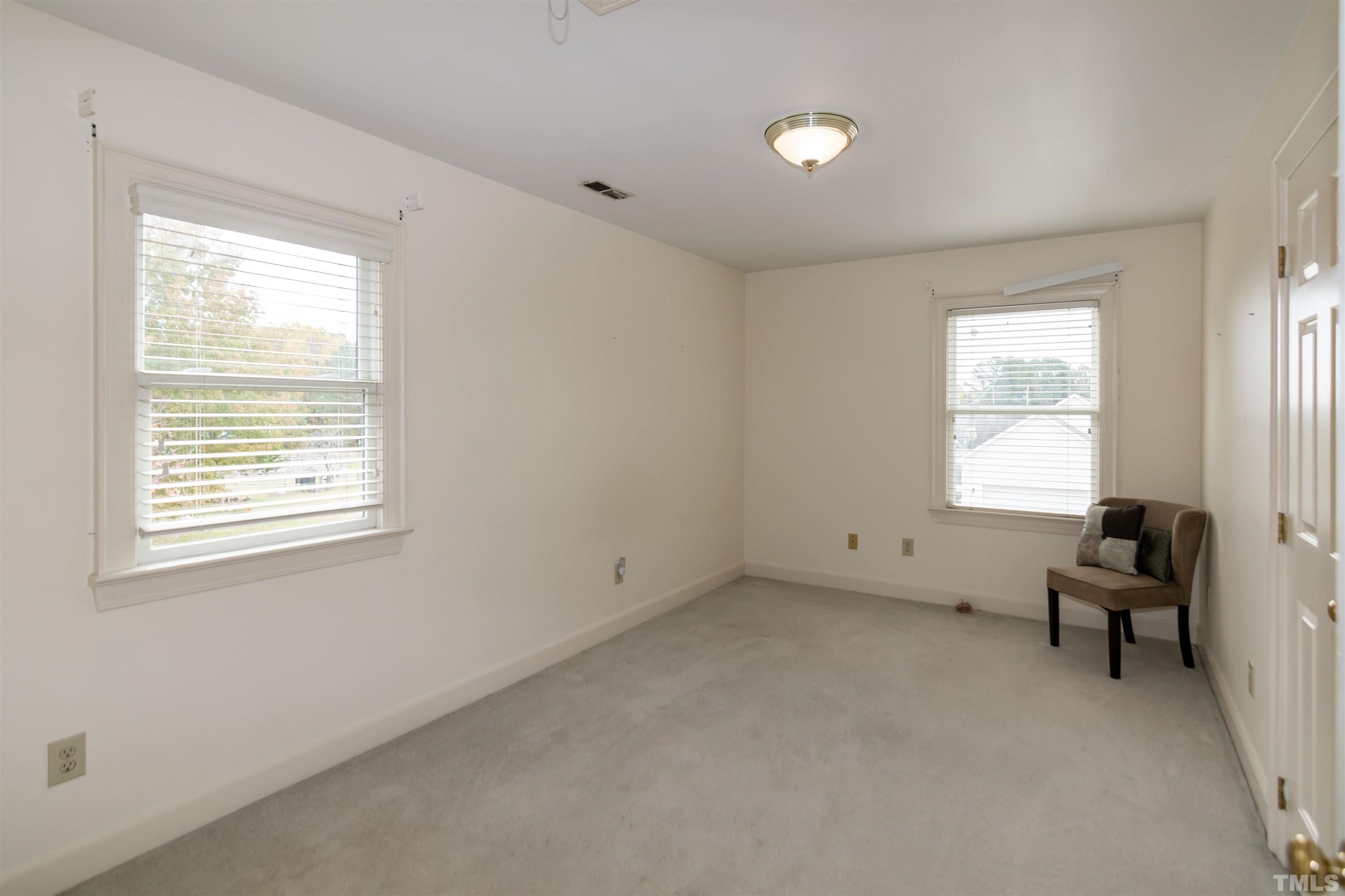 7020 Zebulon Road Wake Forest, NC 27587 - Photo 31 of 45 a view of room with hardwood floor and windows