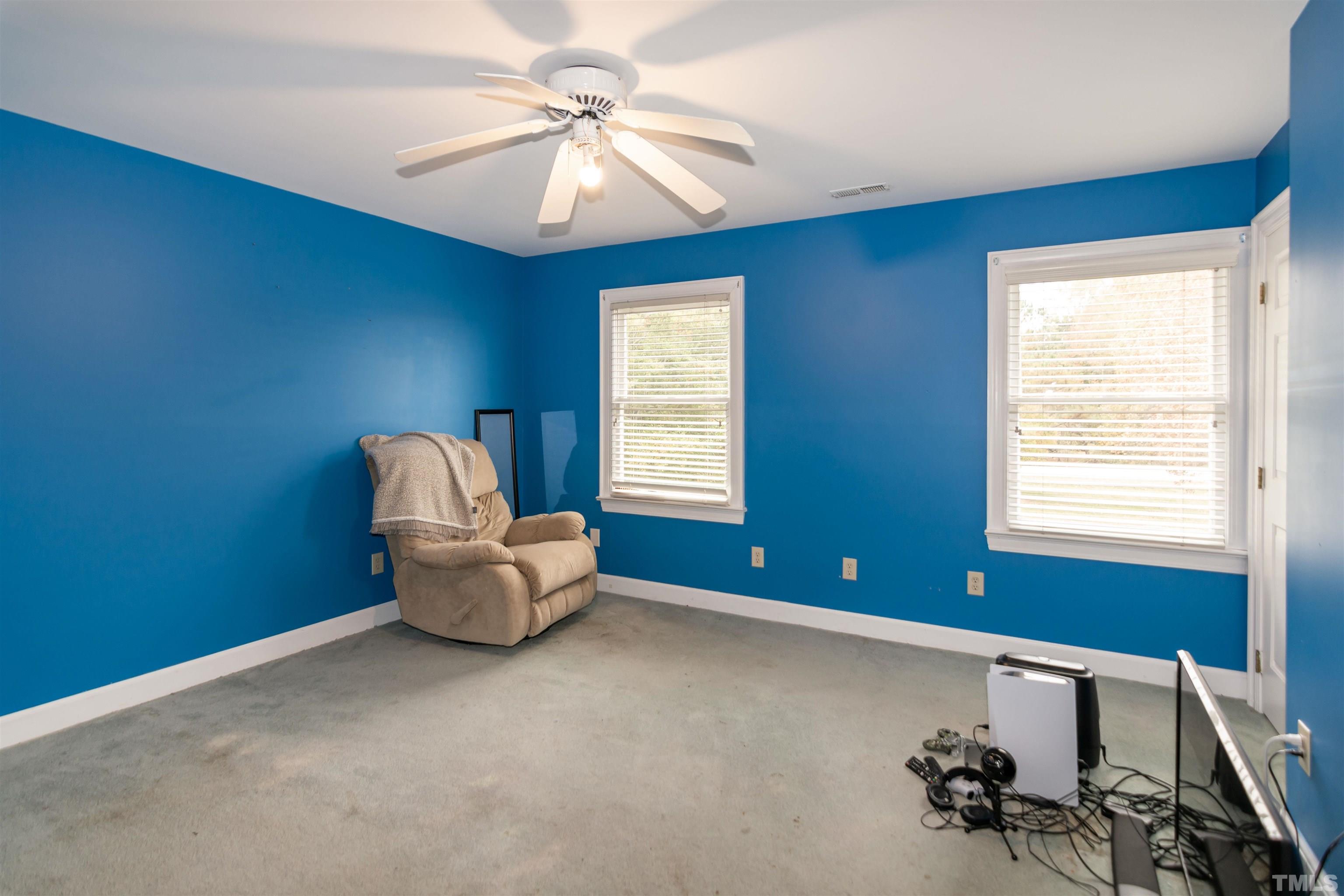 7020 Zebulon Road Wake Forest, NC 27587 - Photo 32 of 45 a living room with furniture and a window