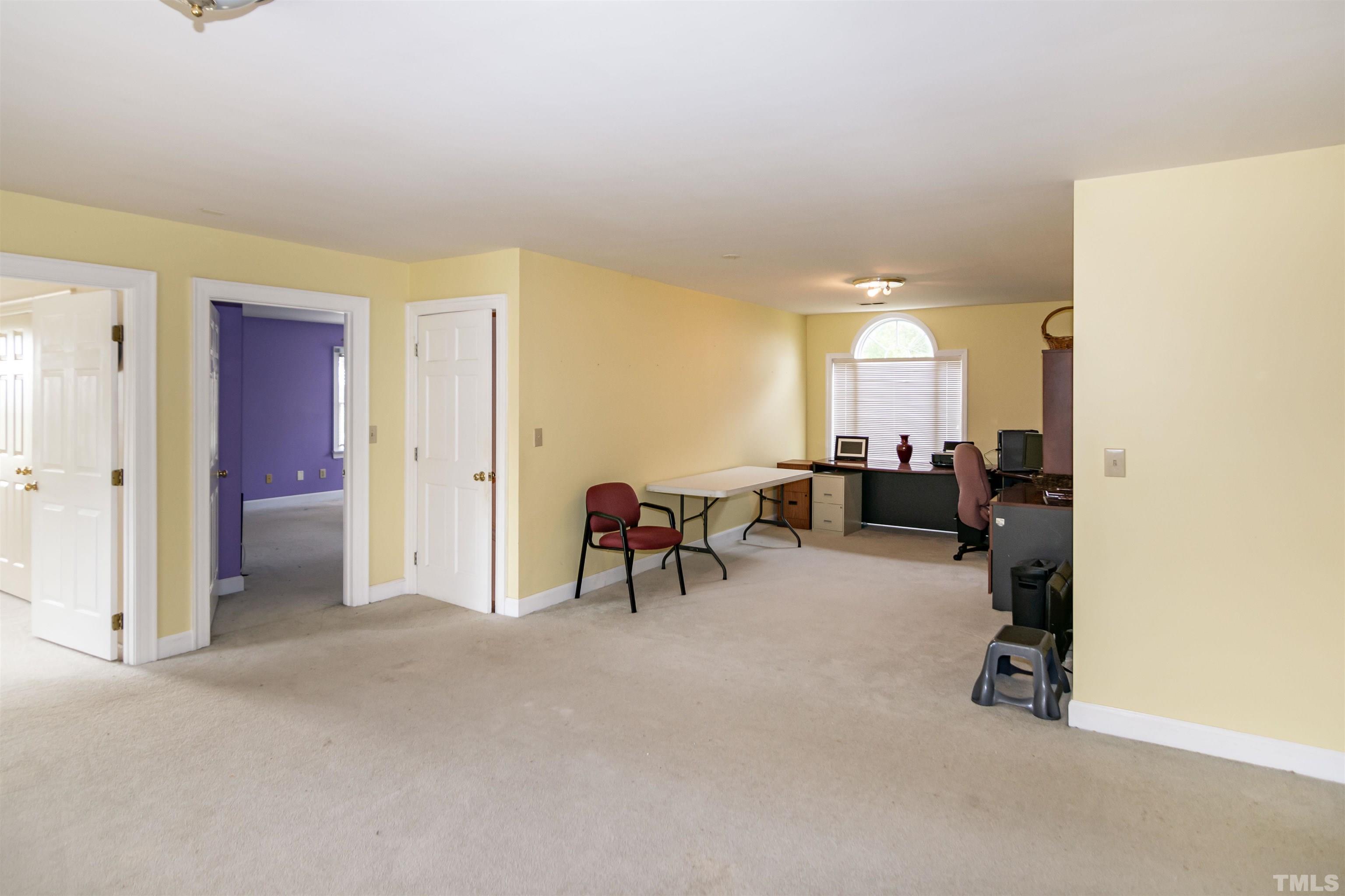 7020 Zebulon Road Wake Forest, NC 27587 - Photo 36 of 45 a view of a livingroom with workspace and a couch