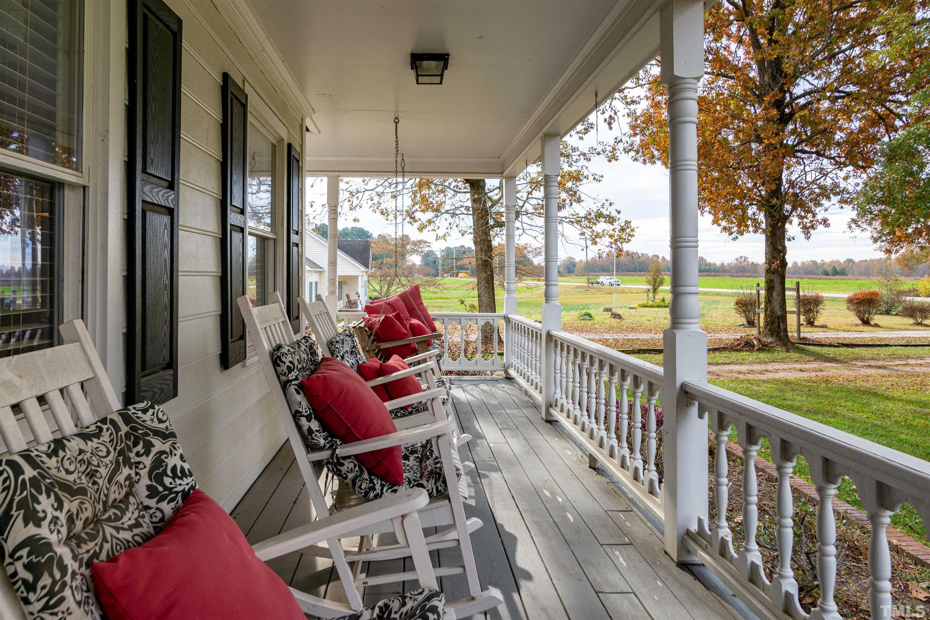 7020 Zebulon Road Wake Forest, NC 27587 - Photo 4 of 45 a view of a porch with chairs and couches