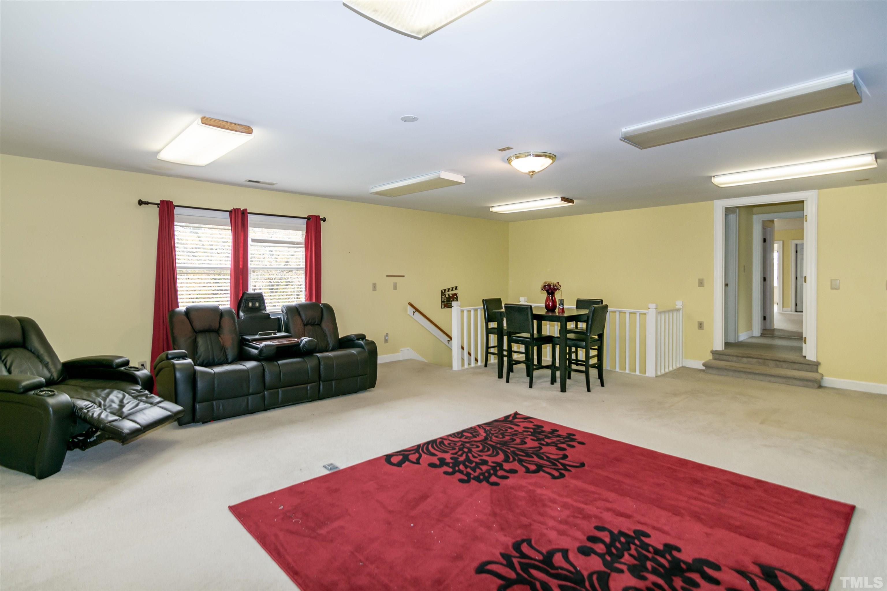7020 Zebulon Road Wake Forest, NC 27587 - Photo 42 of 45 a living room with furniture a dining table and kitchen view