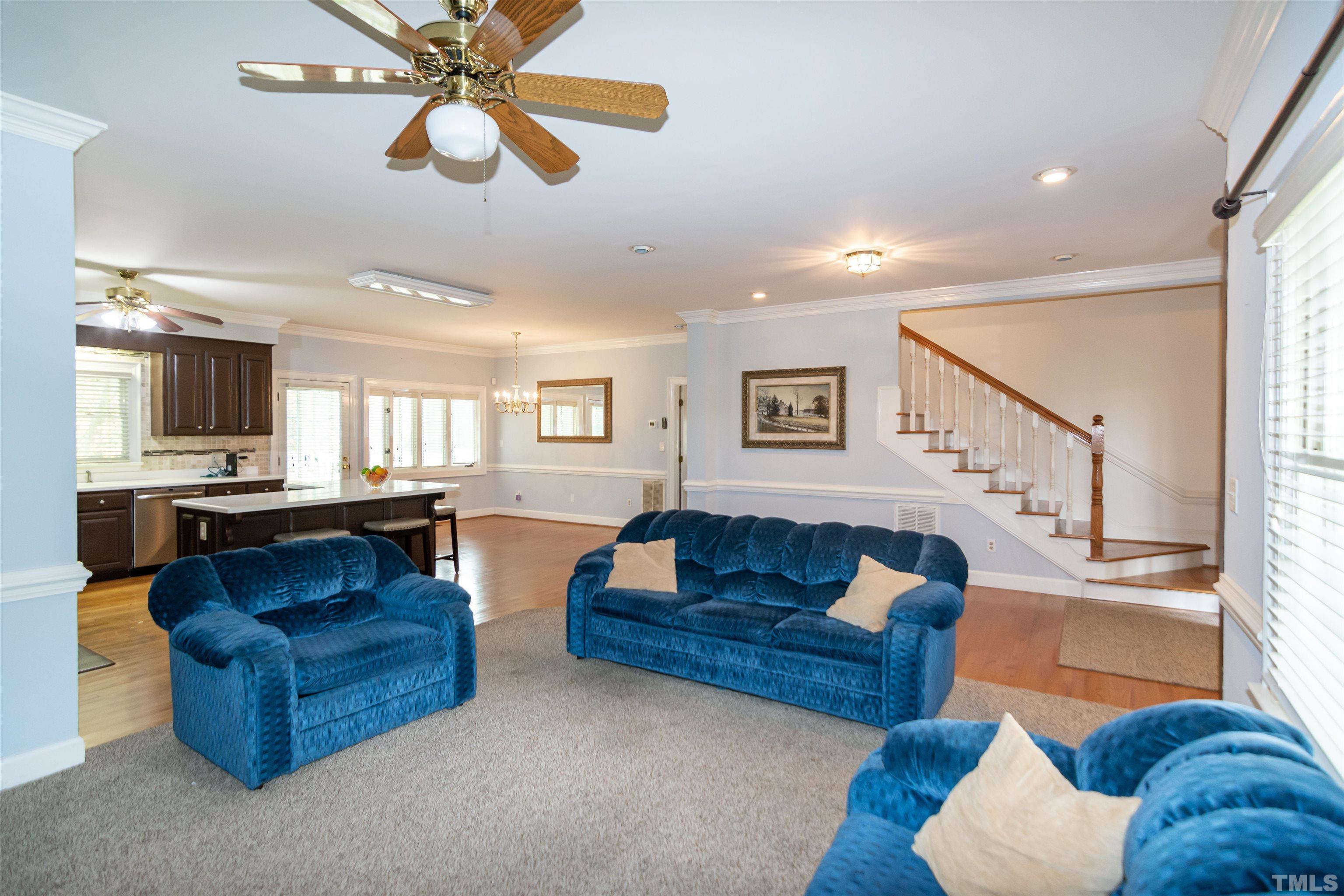 7020 Zebulon Road Wake Forest, NC 27587 - Photo 8 of 45 a living room with furniture and a view of kitchen
