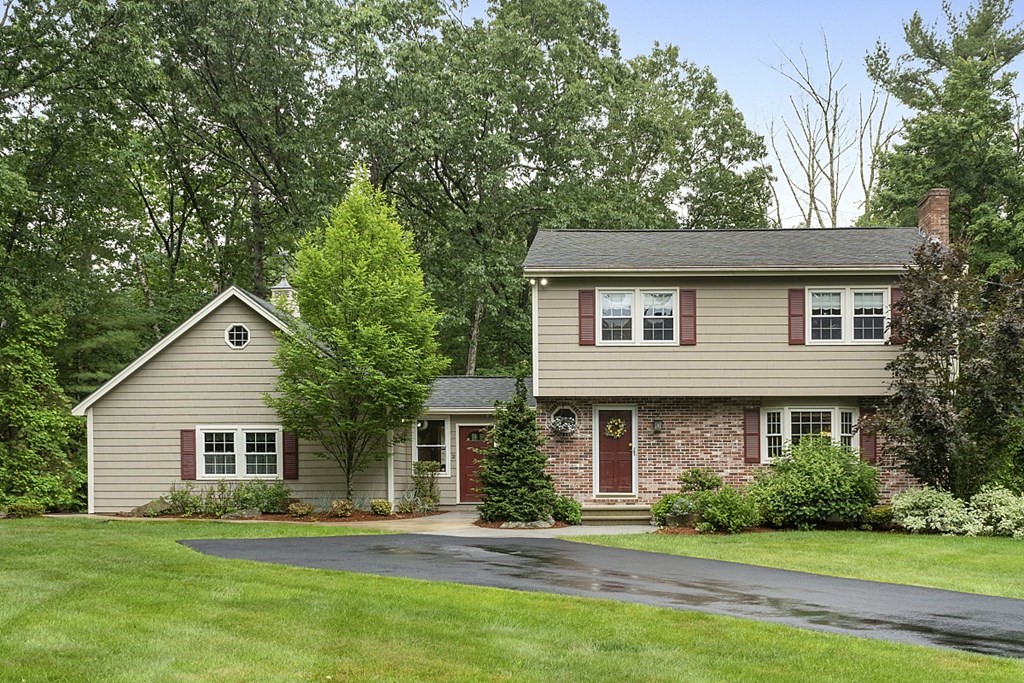 2 Groton Road Tyngsborough, MA 01879 - Photo 1 of 39 a front view of a house with a garden