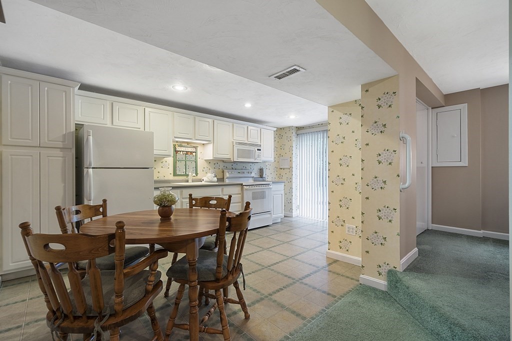 2 Groton Road Tyngsborough, MA 01879 - Photo 26 of 39 a dining room with furniture a table and chairs