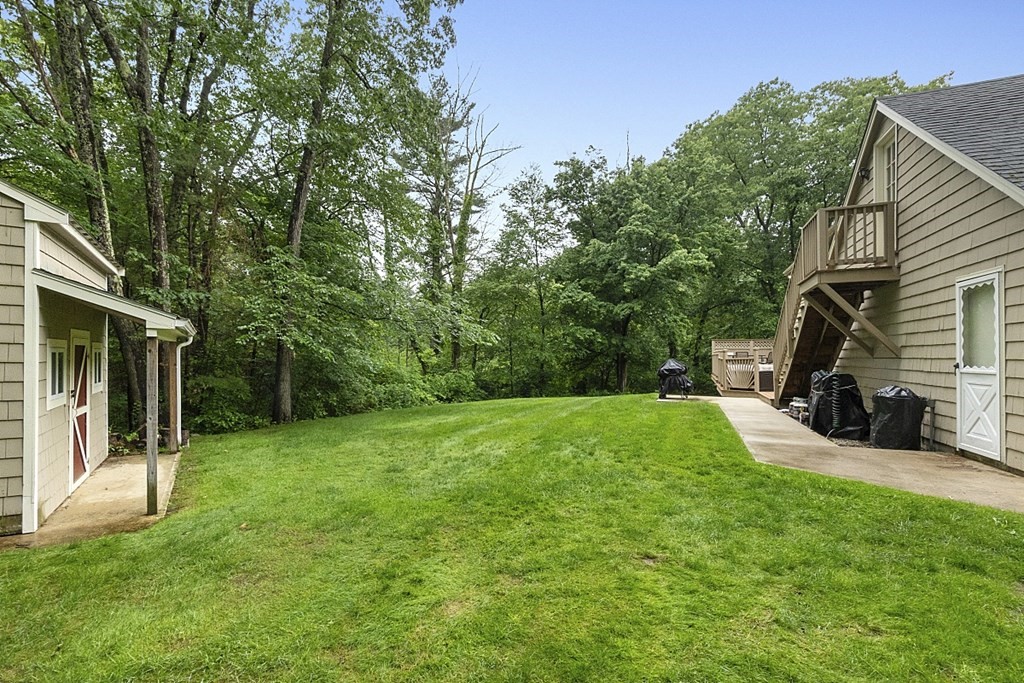 2 Groton Road Tyngsborough, MA 01879 - Photo 31 of 39 a view of a back yard of the house