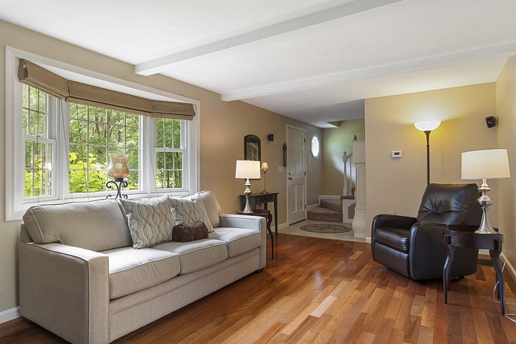 2 Groton Road Tyngsborough, MA 01879 - Photo 8 of 39 a living room with furniture and a large window