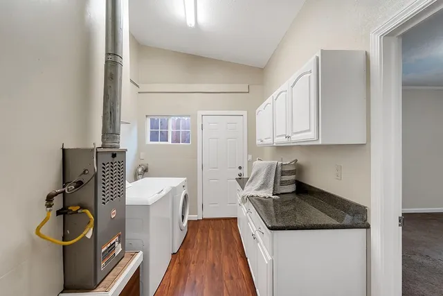 a view of a chairs and table in the balcony