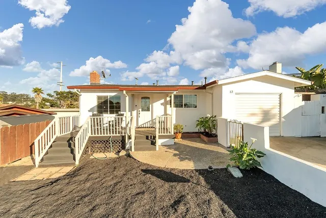 a view of a patio with swimming pool table and chairs