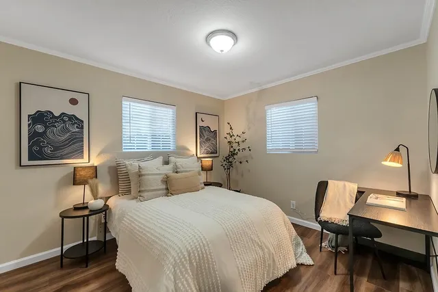 a bedroom with a bed and a desk