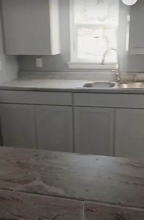 a view of wooden floor and a window
