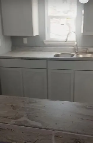 a view of wooden floor and a window