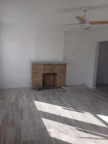 a room with a fireplace and cabinet