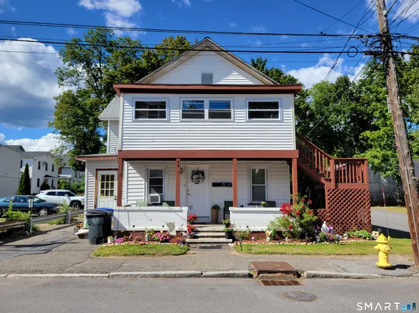 a front view of a house with garage