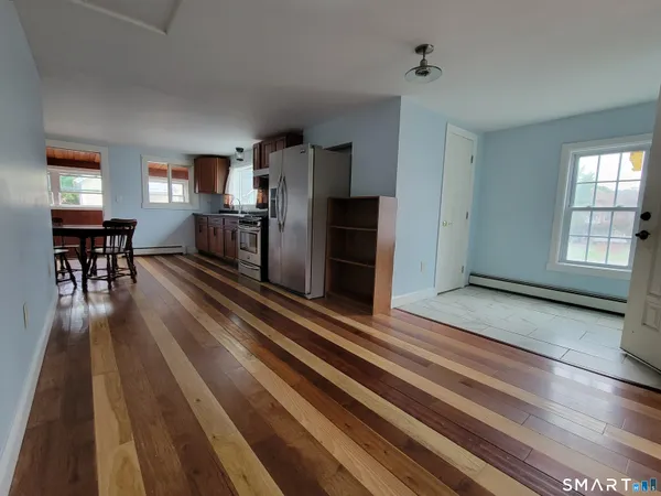 a view of a living room and dining room