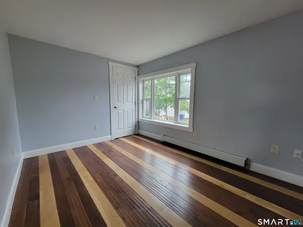 a view of an empty room and window