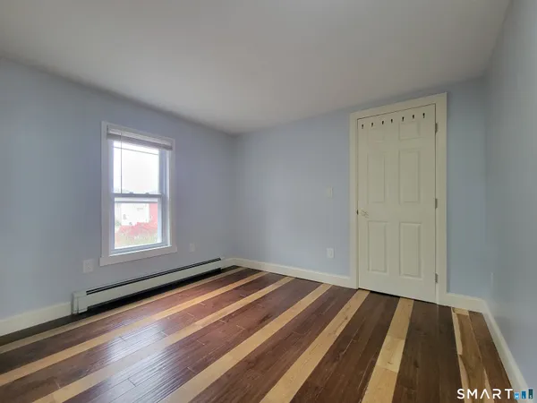 a room with a bed and a window