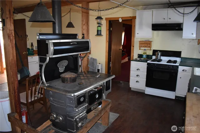 a kitchen with stainless steel appliances granite countertop a stove and a refrigerator