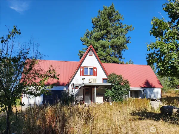 a house with trees in the background