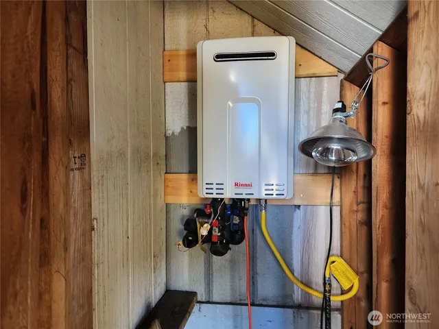 a view of a hallway with wooden floor and entryway