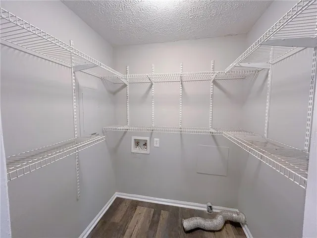 a view of a room with racks on the wall