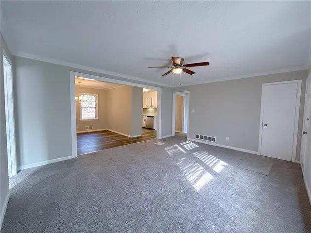 a view of an empty room with a window