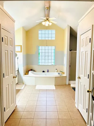 a bathroom with a double vanity sink and mirror