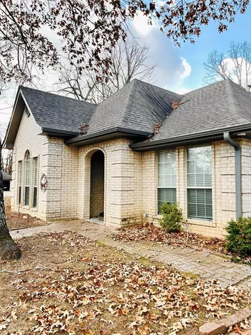 a view of a yard with a large tree