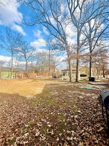 a view of a yard with a house