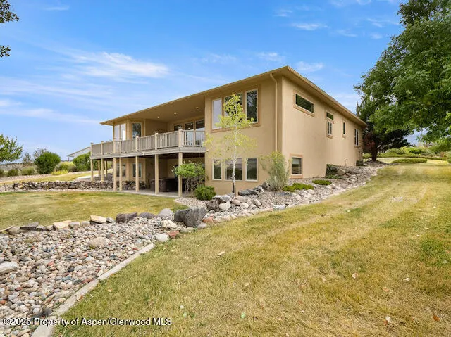 a kitchen with refrigerator and cabinets