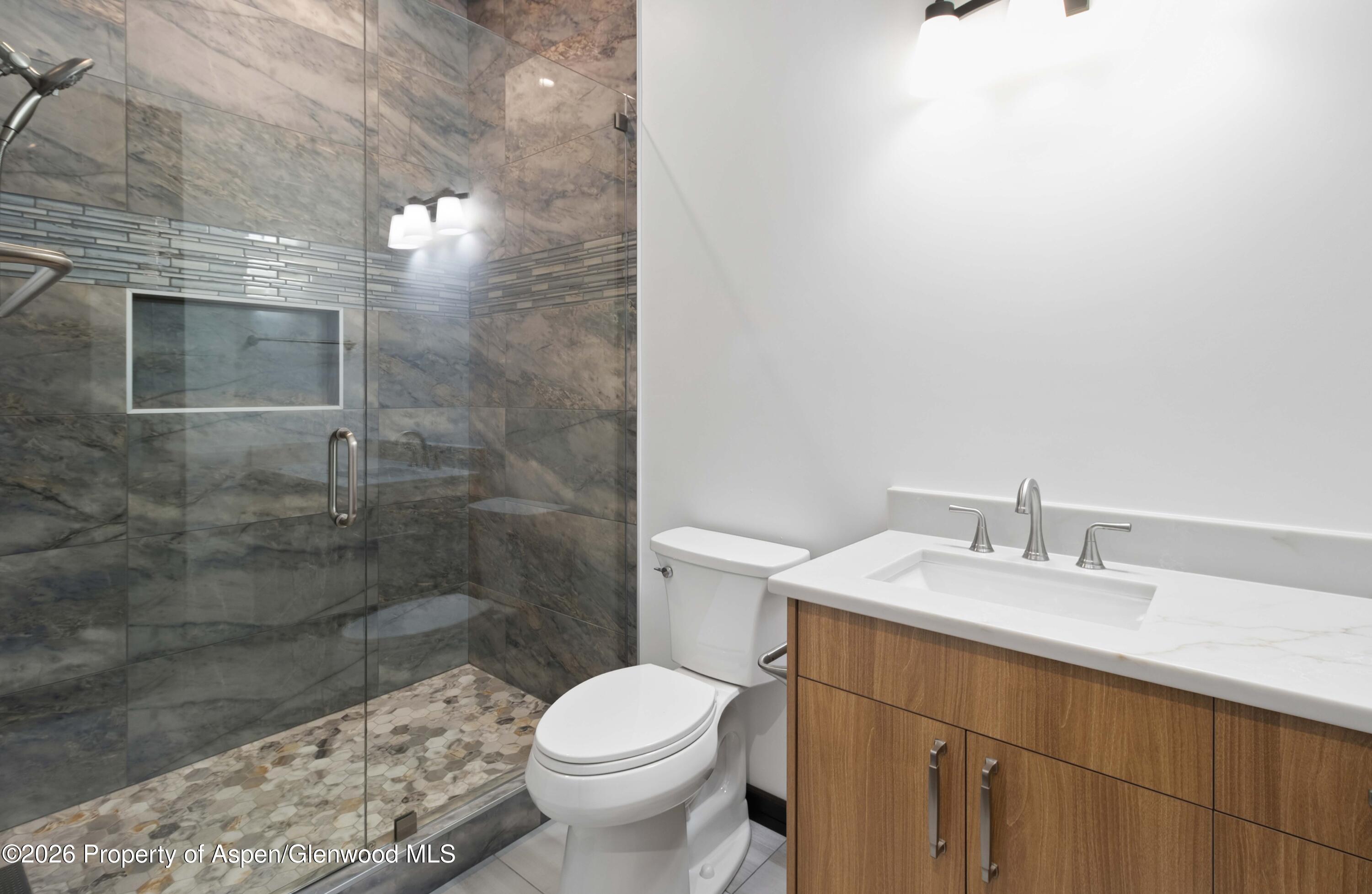 342 Faas Ranch Road New Castle, CO 81647 - Photo 17 of 29 a bathroom with a sink a toilet and shower