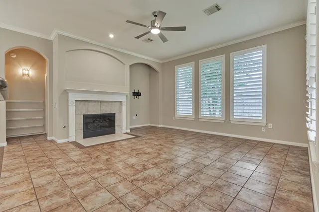 a view of a kitchen with a sink and a fireplace
