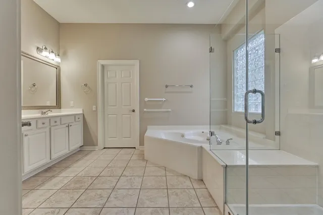 a bathroom with mirror and sink
